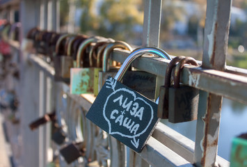 Names on the padlocks as a proof of love
