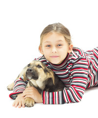 little girl hugging her four-footed friend on a white background