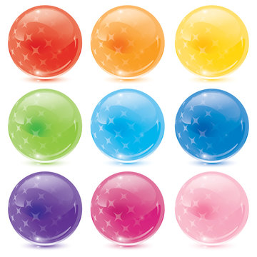 set of glass balls with stars glowing