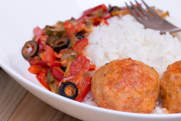 Spanish Meatballs albondigas with vegetables and cooked rice