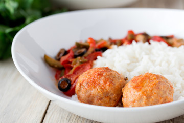 Spanish Meatballs albondigas with vegetables and cooked rice