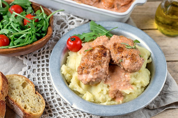 Cabbage and meat balls in tomato sauce