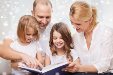 Fototapeta na wymiar happy family with book at home