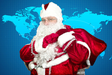 Santa Claus with gifts on a map background