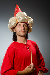 Funny wizard wearing red dress
