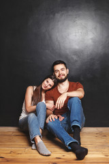 couple sitting near the wall