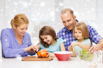 happy family with two kids making dinner at home