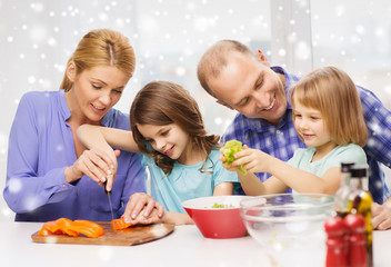 happy family with two kids making dinner at home