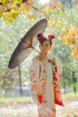 Young european girl in traditional japanese kimono