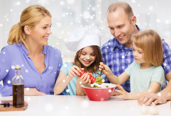 happy family with two kids making salad at home