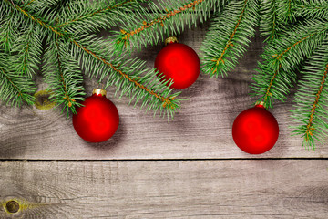 Christmas tree with baubles on wood texture