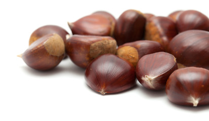 sweet chestnuts isolated on white