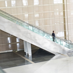 business people on escalator