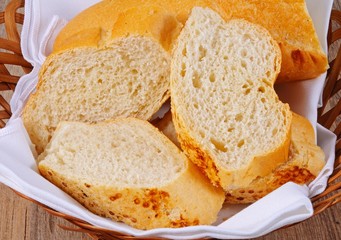 Pieces of bread in a basket © Arena Photo UK