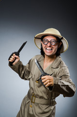 Funny safari hunter against background