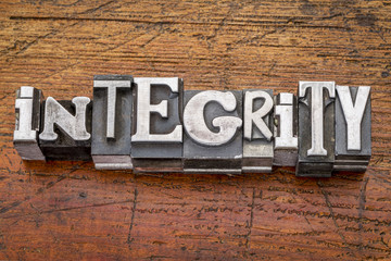 integrity word in metal type