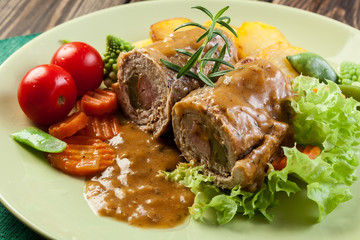 Pork rolls with prepared potatoes and vegetables
