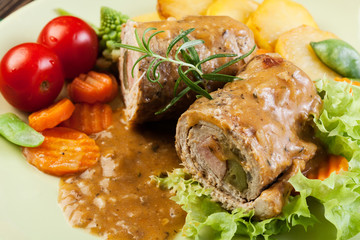 Pork rolls with prepared potatoes and vegetables