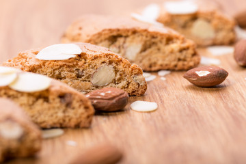 Cantuccini on wooden background, typical tuscan biscuits