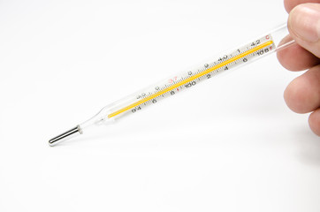 hand holding medical mercury thermometer