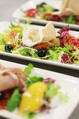 plated salads in event kitchen