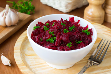 Traditional Russian salad with grated beetroot and garlic