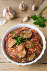 Roasted eggplant pieces with spicy raw tomato dip
