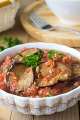 Roasted eggplant pieces with spicy raw tomato dip