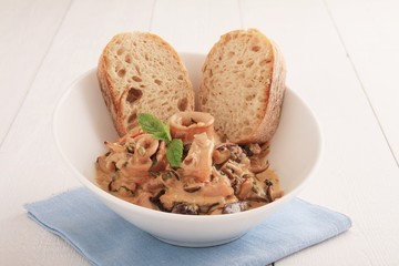 squid soup in bowl with ciabatta bread
