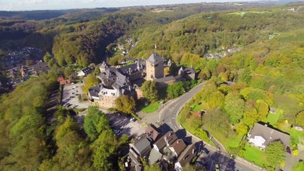 Ancient 600 year old castle in Germany Europe, aerial, village