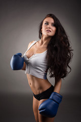 Studio shot of sexy female boxer