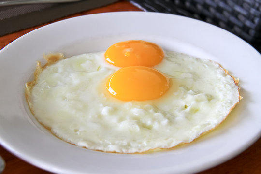 Fried twin egg on a plate