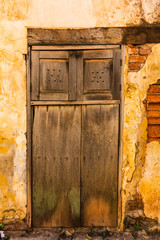 old brick wall with wooden door