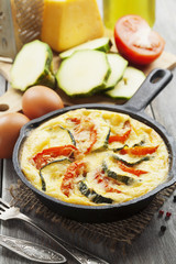 Omelette with zucchini and tomatoes