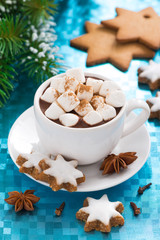 hot chocolate with marshmallows on a blue background, vertical