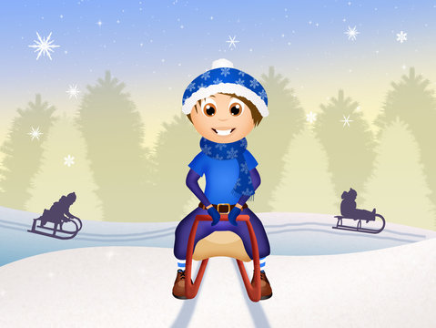 child on sleigh in winter landscape