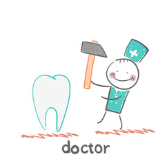 doctor hammers on the tooth