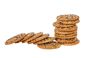 Stackand pile of round cookies with sesame and flax seeds