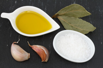oil with salt, garlic with bay leaf