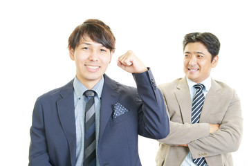 ガッツポーズの二人のビジネスマン