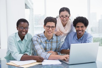 Casual business team working together at desk