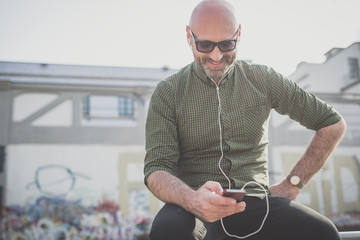 handsome middle aged man listening to music