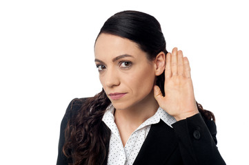 Business woman with hand to ear