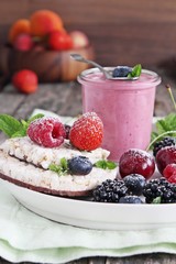 Healthy breakfast with dietary rice waffles, yogurt and berries.