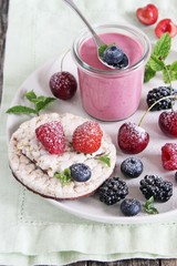Healthy breakfast with dietary rice waffles, yogurt and berries.