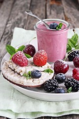 Healthy breakfast with dietary rice waffles, yogurt and berries.