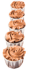 Moist chocolate cupcake over white background
