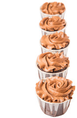 Moist chocolate cupcake over white background