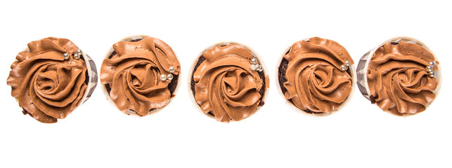 Moist chocolate cupcake over white background