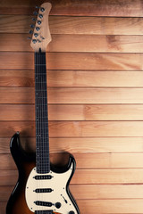 Obraz premium Guitar on wooden background